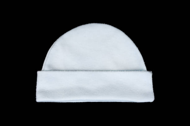 white knitting wool baby hat isolated on black