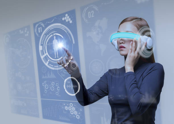 istock futuristic woman wearing head mount display and touching stereoscopic vision 690721716