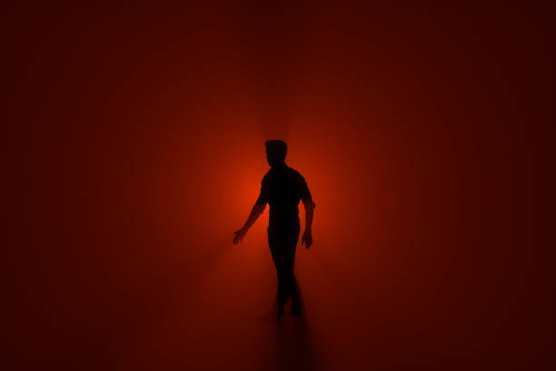istock person in the hazy fog in a red light background. 3D Rendering. 690724302