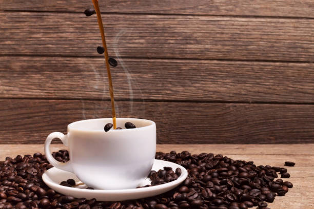 istock pouring coffee and roasted coffee beans 690727208