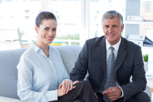 istock Smiling business partners looking at camera 690727246