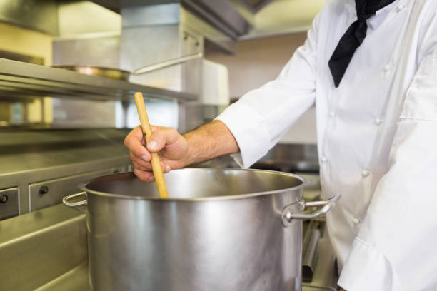istock Male chef preparing food in kitchen 690727436