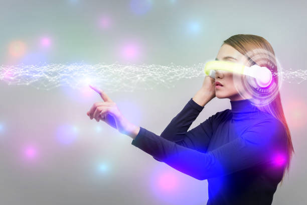 istock futuristic woman wearing head mount display 690730458