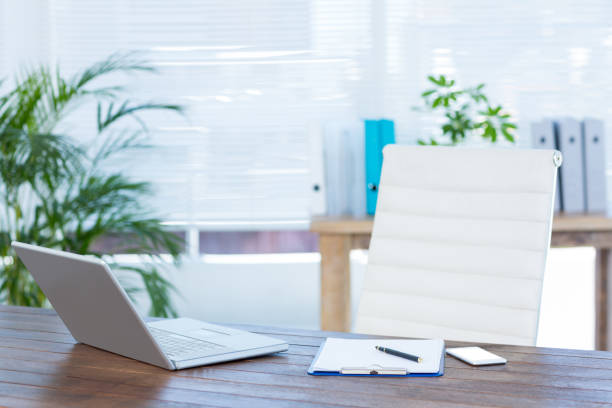 istock Business desk with laptop and notebook 690730548
