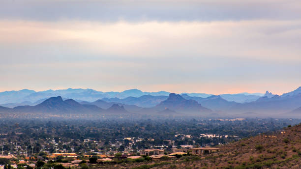 istock Hazy mountains behind town 690737690