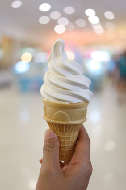 istock Milk ice cream in hand and have bokeh light background. 690738798