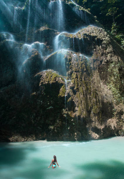 istock Woman in Beautiful waterfall in Cebu 690739342