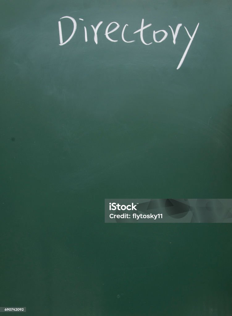 directory title handwritten with white chalk on blackboard blackboard sign Arrangement Stock Photo