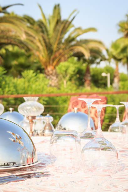 Special occasion table setting in a luxury outdoor restaurant. Festive celebration background. Vertical