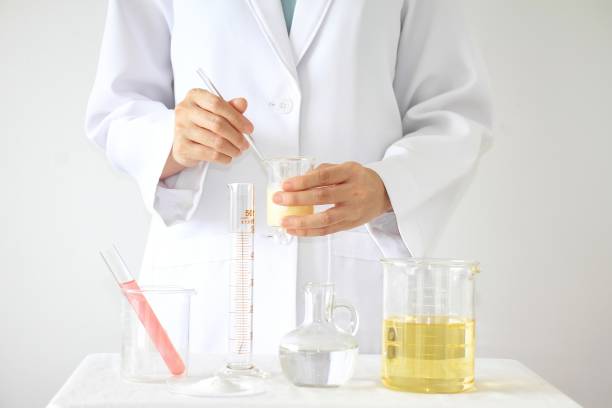 istock Scientist hand with equipment and science experiments, Pharmacist formulating the chemical for medicine. 690750488