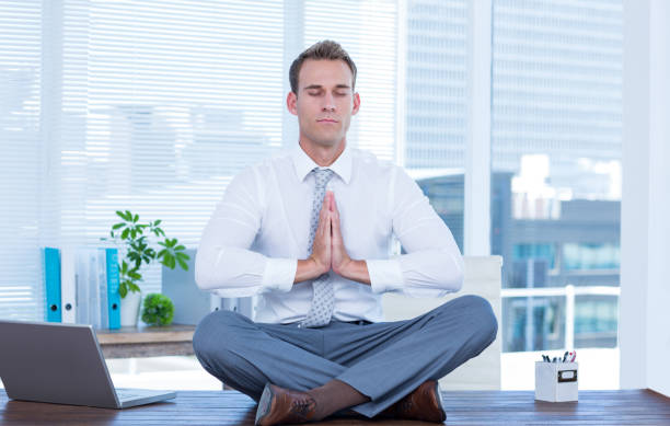istock Zen businessman doing yoga meditation 690761224