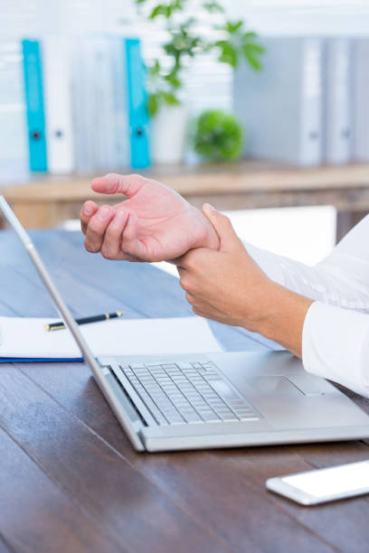 istock Close up view of man massaging his wrist 690761604