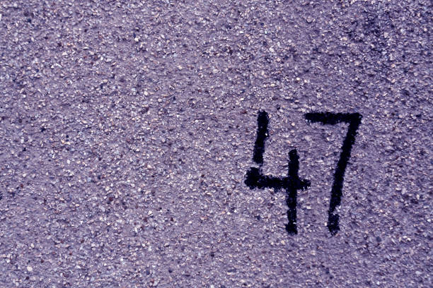 istock number fourty seven on blue plaster wall. 690780590