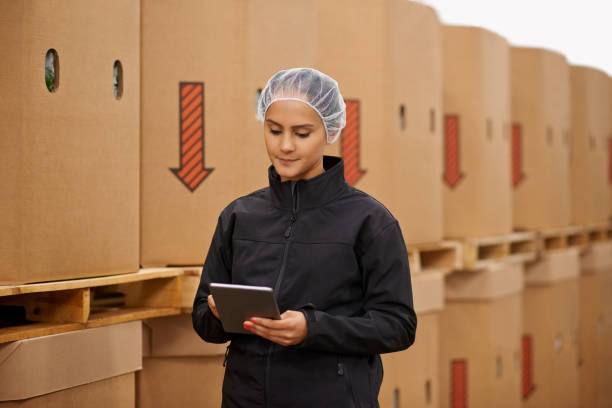 istock Keeping track of all her stock from one device 690781478