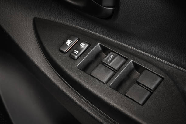 istock Car Door Lock Button Closeup. Electric Locking Button in Modern Car 690781722