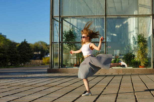 istock Girl jumping in urban space 690784030