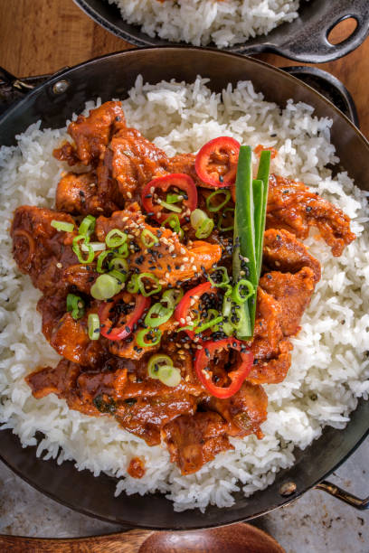 istock Chopped Pork Meat Cooked with Red Chili Paste, Gochujang Sauce, over Rice 690784750