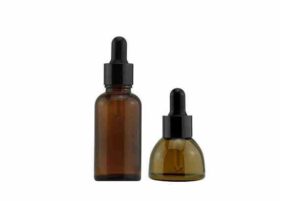 istock Set of cosmetic brown bottle dropper container isolated on white background, Blank label for branding mock-up. 690787254