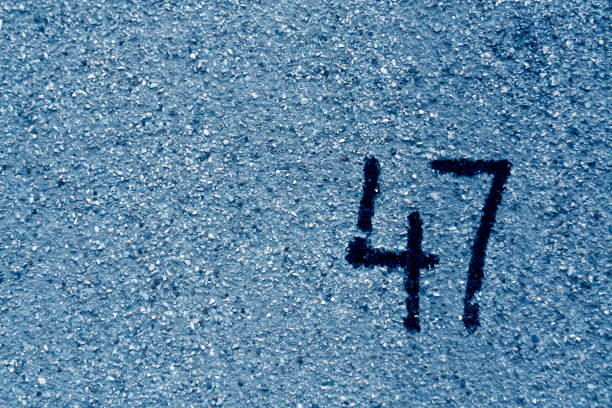 istock number fourty seven on blue plaster wall. 690793424
