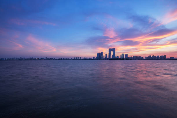 China's first-tier cities in Suzhou waterfront skyline, evening