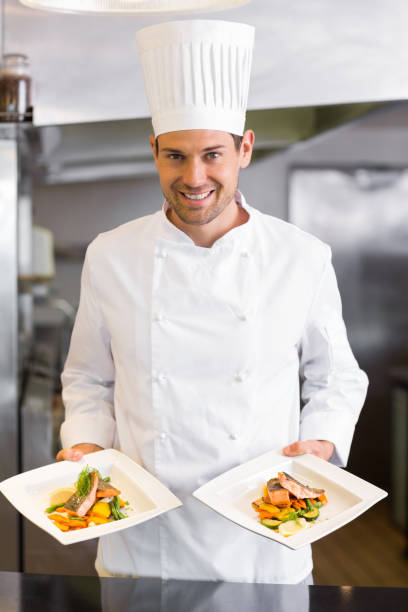 istock Confident male chef with cooked food in kitchen 690797682