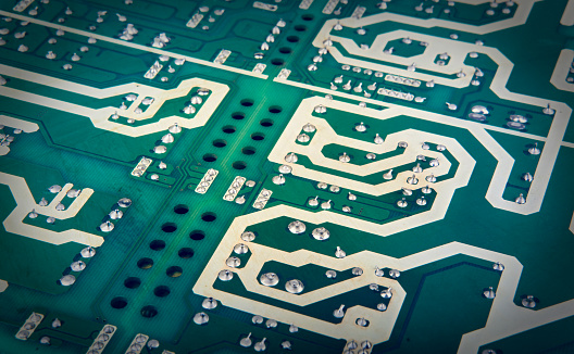 Macro Close up of printed wiring and components on PC circuit board