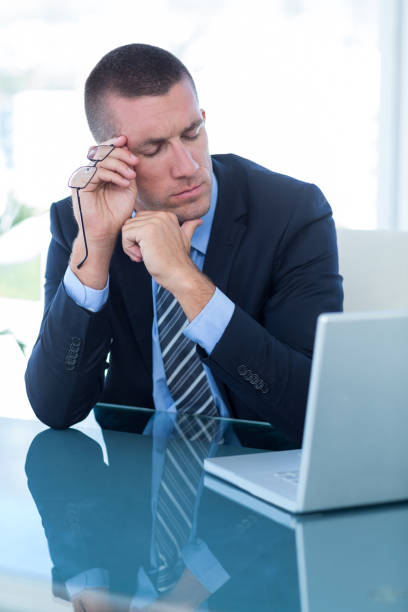 istock Thoughtful businessman in his office 690800584