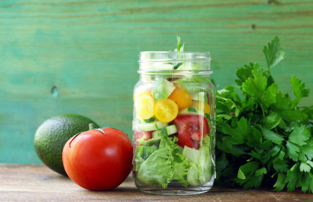 istock Fresh vegetable salad in a glass jar 690800616