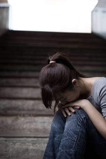 istock depressed woman in underground 690801394