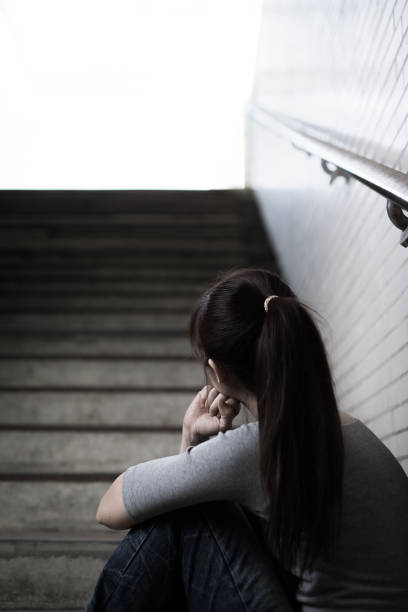 istock depressed woman in underground 690804060
