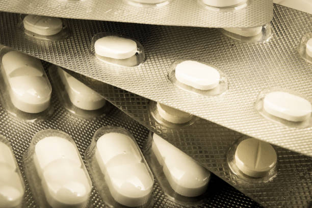 fundo de comprimidos - painkiller vitamin pill full frame macro - fotografias e filmes do acervo