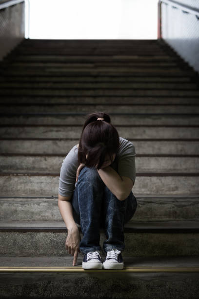istock depressed woman in underground 690809874