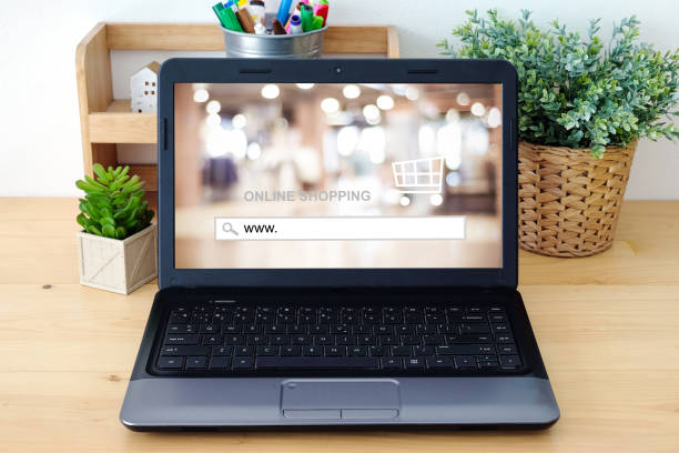 istock www. on search bar over blur store background on notebook screen, on line shopping ,business, E-commerce, technology and digital 690810722