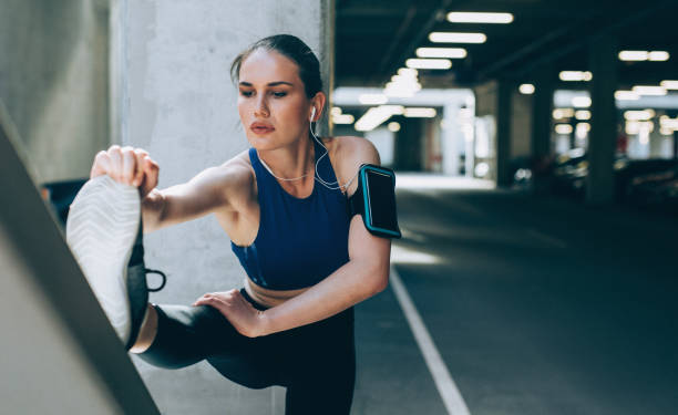 istock Sportswoman stretching outdoors 690812950