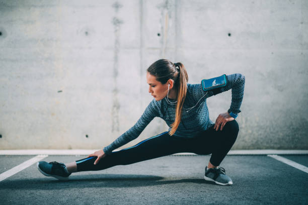 istock Sportswoman stretching outdoors 690812960