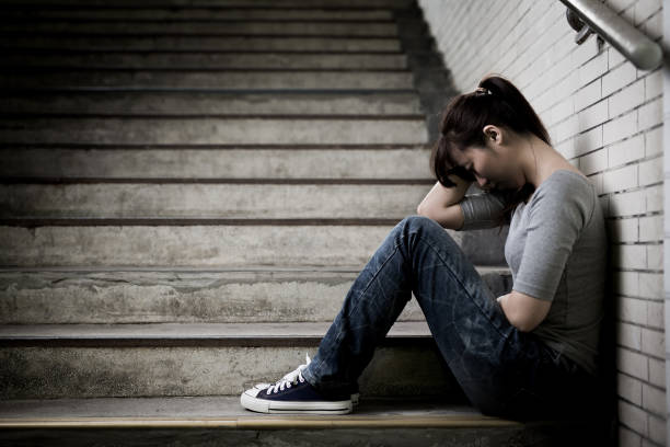 istock depressed woman in underground 690817094