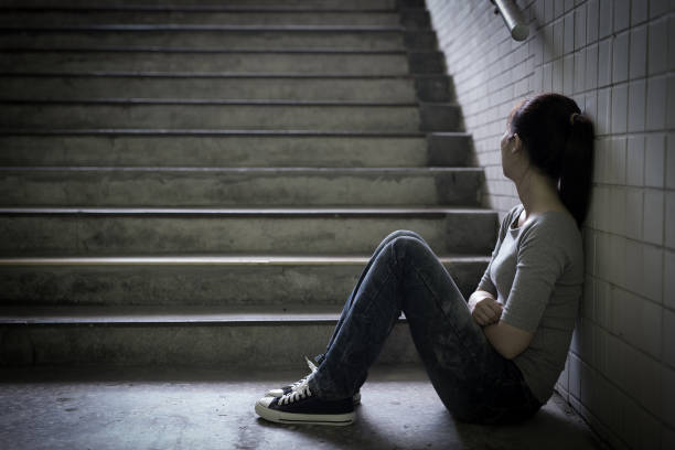 istock depressed woman in underground 690819532