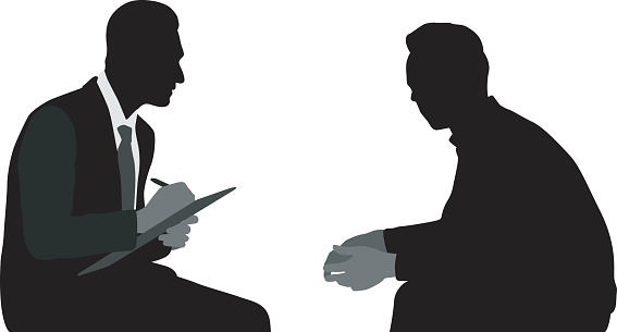 Silhouette vector illustration of a councellor taking notes while his patient is talking