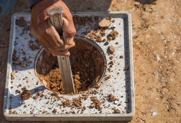 DENSITY OF SOIL IN PLACE BY THE SAND-CONE METHOD