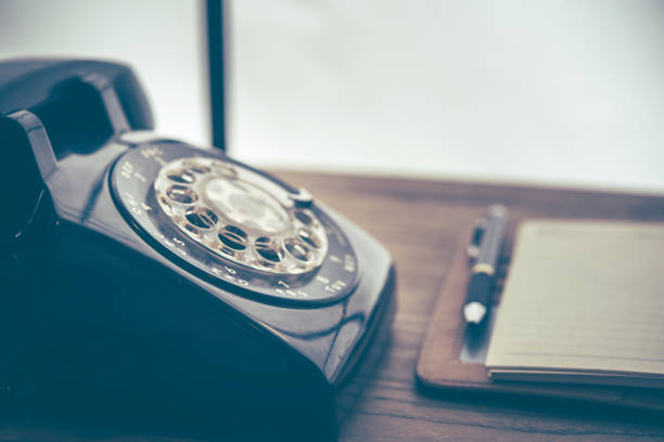 Old black phone with dust and scratches, retro style concept