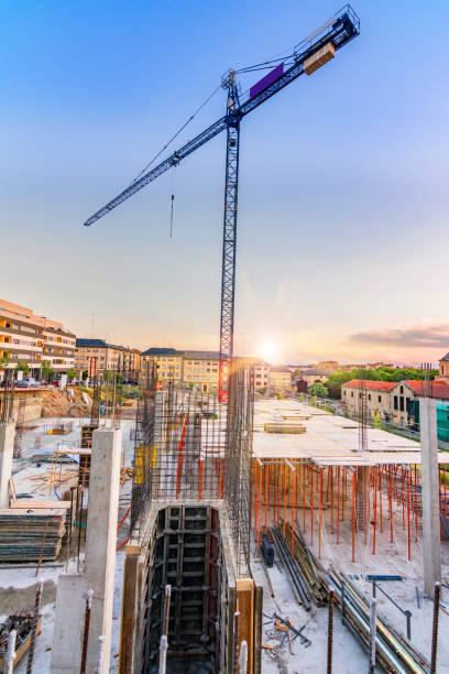 istock Construction of houses with cranes 690826364