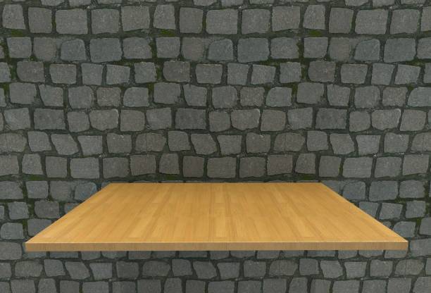 istock Empty top wood laminate floor shelves and cobblestone wall background. For product display 690826856