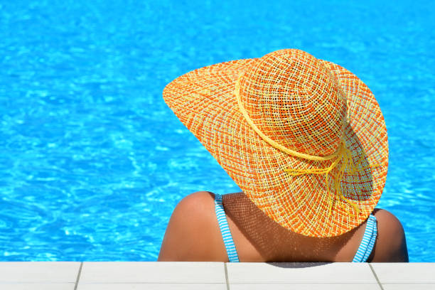 istock Real female beauty relaxing at swimming pool 690830502