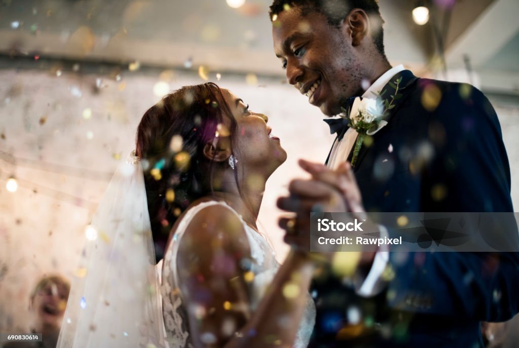 Newlywed african descent couple dancing wedding celebration Wedding Stock Photo