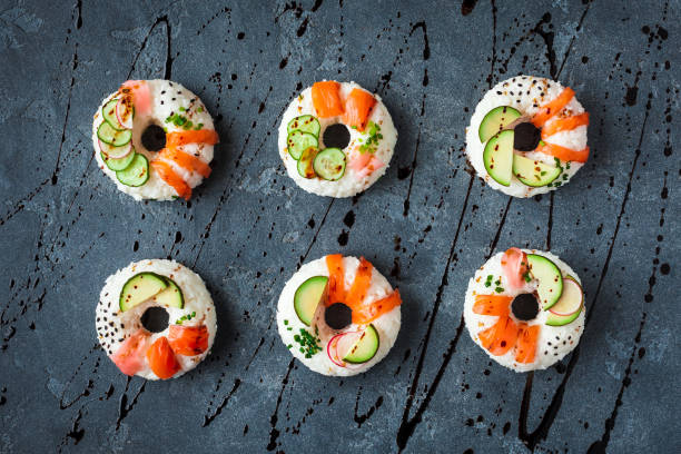 Sushi donuts set on black background. Flat lay, top view
