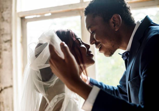 istock African Descent Groom Open Bride Veil Wedding Celebration 690834090