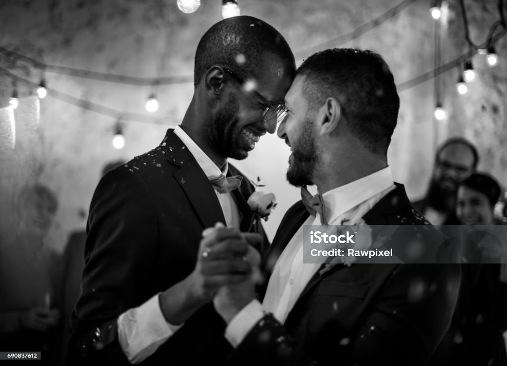 Newlywed Gay Couple Dancing on Wedding Celebration Wedding Stock Photo