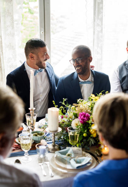 istock Cheerful Gay Couple in Wedding Reception 690837782