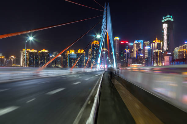 istock urban traffic road with cityscape at night 690838164