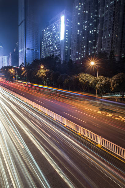 istock urban traffic road with cityscape at night 690842328